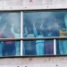 People holding hands on Feb. 18 at a hotel in Panama City where migrants from Asia and the Middle East were housed after being deported from the United States.Enea Lebrun / Reuters file