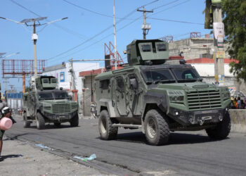 Armored vehicles of the Kenyan peace-keeping mission patrol as residents flee their neighborhood due to gang violence, in Port-au-Prince, Haiti, Feb. 25, 2025.