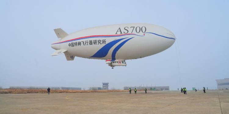China's AS700D electric manned airship is pictured during its maiden flight in Jingmen, central China's Hubei Province, Feb. 21, 2025. China's AS700D electric manned airship completed a successful maiden flight on Friday, marking a major breakthrough for the country in green aviation equipment in the low-altitude economy sector, announced the Aviation Industry Corporation of China (AVIC), the developer of the airship. (AVIC/Handout via Xinhua)