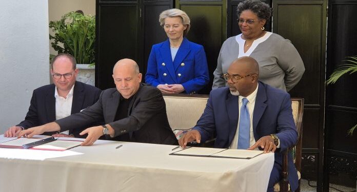 Signing ceremony of the Letter of Intent between BioMed X and the Government of Barbados. [Left to Right standing] Ursula von der Leyen, President of the European Commission, Mia Amor Mottley, Prime Minister of Barbados, [Left to Right sitting] Dr Gerhard Ries, Co-Founder and Chairman of the Supervisory Board of BioMed X, Dr Christian Tidona, Founder and Managing Director of BioMed X, and Mark Hill, CEO of Export Barbados