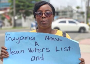 Opposition Member of Parliament Nima Flue-Bess protesting at GECOM