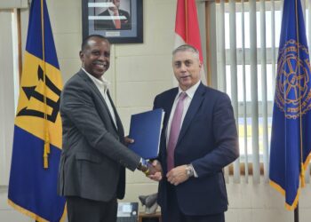 RSS Executive Director Rear Admiral Errington Shurland and RCMP Regional Director for Latin America and the Caribbean Brian Moreau sign the Memorandum of Understanding
