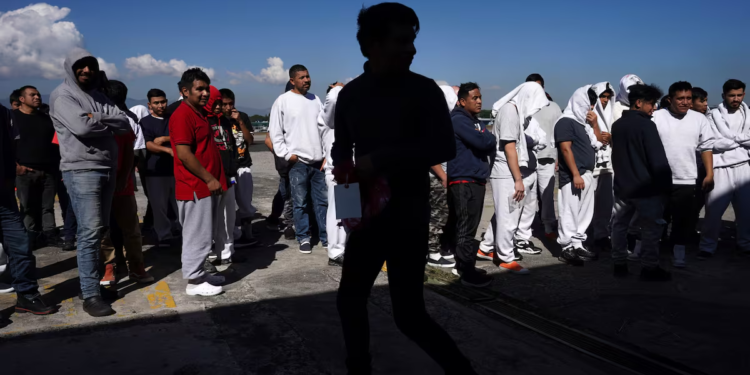 Guatemalan migrants deported from the United States arrive at La Aurora International Airport. Moises Castillo (AP)