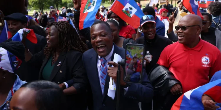 Members of the Haitian community and their allies at a rally against President Donald Trump’s rhetoric towards Haitian migrants in Ohio, in Boston, Mass., on Sep. 24, 2024.Jessica Rinaldi—The Boston Globe/Getty Images