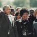 Nelson and Winnie Mandela walk together in this iconic photo after he's released from prison in 1990