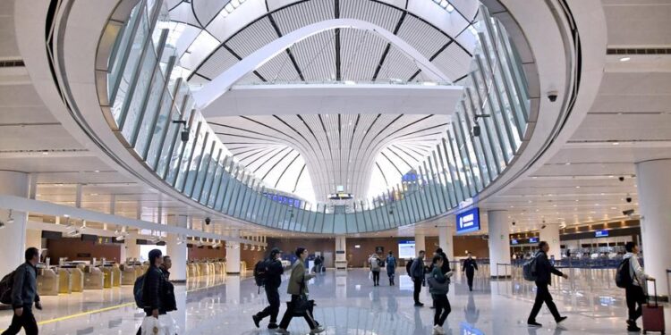 Foreign tourists go through customs at the Beijing Daxing International Airport in Beijing, capital of China, Dec. 27, 2024. (Xinhua/Ju Huanzong