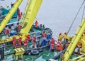 File photo shows workers laying submarine cable on the construction boat in Zhoushan, east China's Zhejiang Province. (Xinhua/Xu Yu)