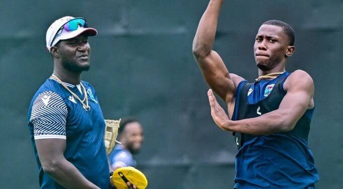 West Indies' pacer Shamar Joseph bowls as head coach Daren Sammy looks on during a practice session in Sri Lanka last year. - File photo