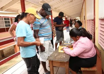 A beneficiary collects his cash grant in Region One