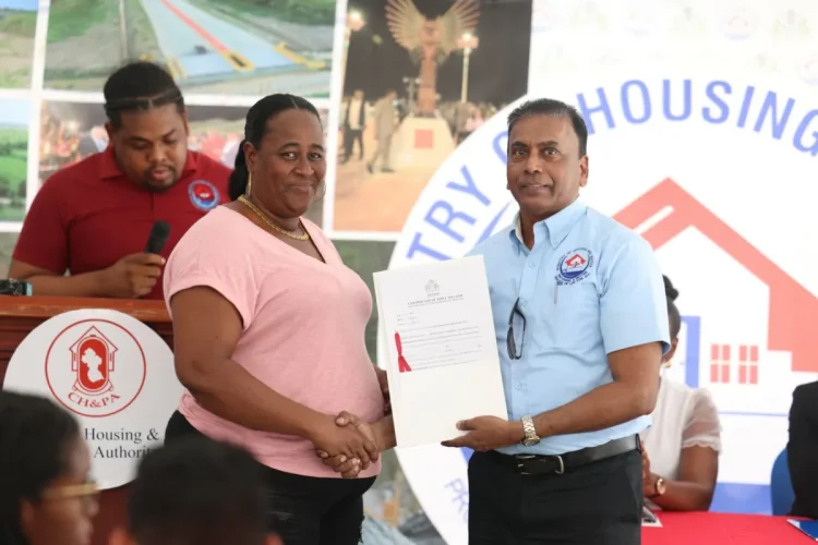 A land title being provided to a Kwakwani resident