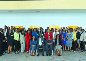 Group Photograph of the participants of the Ninth Meeting of National AIDS Program Managers and Key Partners. Seated L-R, Dr. Shanti Singh Anthony, Coordinator, Knowledge Management, PCU, Dr. Armstrong Alexis, Deputy Secretary-General, CARICOM Secretariat, Dr. Dale Babb, Senior Medical Officer of Health, responsible for HIV/AIDS, Barbados, Dr. Wendy Telgt Emanuelson, Director PCU