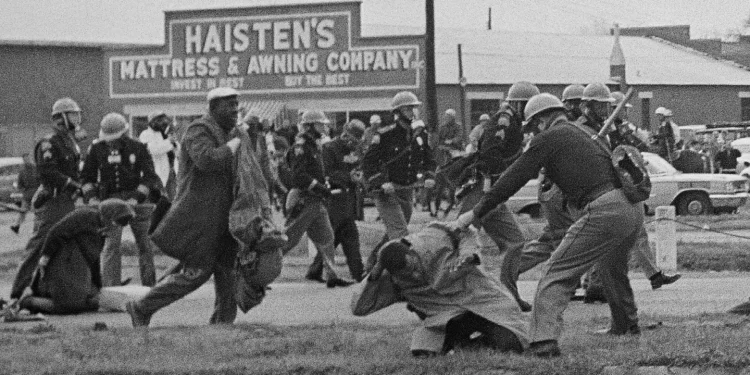 State troopers swing billy clubs to break up a civil rights voting march in Selma, Ala., on Bloody Sunday.AP file