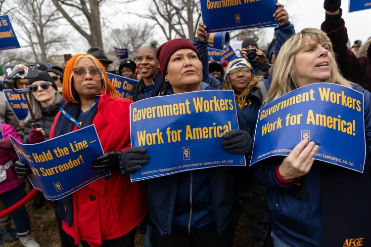 Members of the American Federation of Government Employees (AFGE) union protest against firings during a rally to defend federal workers in Washington, D.C., on Feb. 11, 2025.