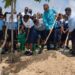 Foreign Secretary and Chairman of the Protected Areas Commission Board of Directors, Mr. Robert Persaud turning the ceremonial sod along with students to launch the National Tree Planting Project
