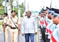 Minister of Home Affairs Robeson Benn inspects police officers during the opening of the conference (DPI photo)
