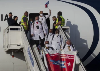 Cuban doctors arrive at the Jose Marti International Airport in Havana, Cuba, June 8, 2020, after traveling to Italy to help with the COVID-19 emergency response. (Ismael Francisco/Pool via AP, File)