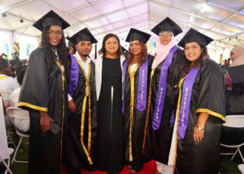 Minister of Education Priya Manickchand (3rd from left) with some graduates under the GOAL programme. (Stabroek News photo)