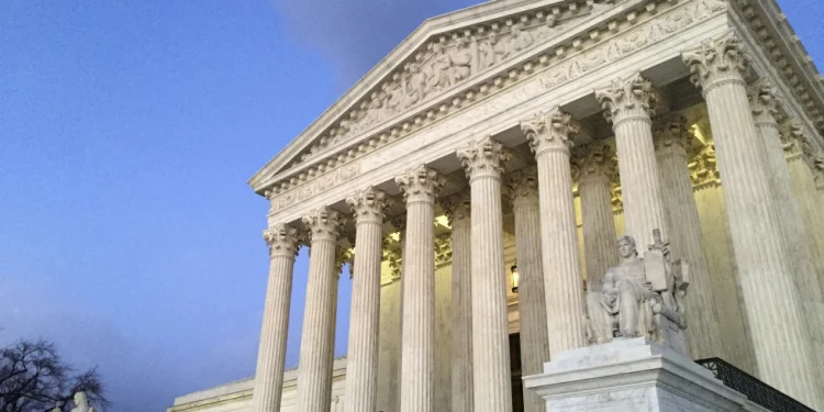 The Supreme Court at sunset in Washington, Feb. 13, 2016. (AP Photo/Jon Elswick, File)