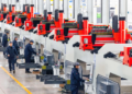 Technicians calibrate laser equipment at an industrial park in Ezhou, central China's Hubei Province, February 8, 2025. /VCG