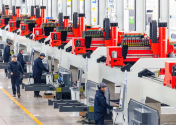 Technicians calibrate laser equipment at an industrial park in Ezhou, central China's Hubei Province, February 8, 2025. /VCG