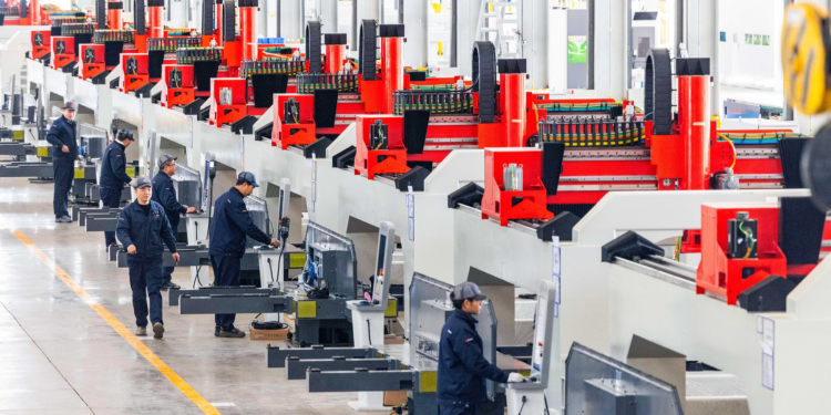 Technicians calibrate laser equipment at an industrial park in Ezhou, central China's Hubei Province, February 8, 2025. /VCG