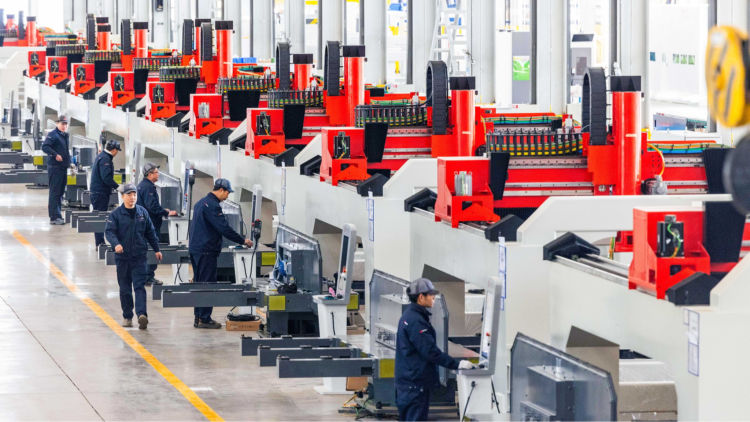 Technicians calibrate laser equipment at an industrial park in Ezhou, central China's Hubei Province, February 8, 2025. /VCG