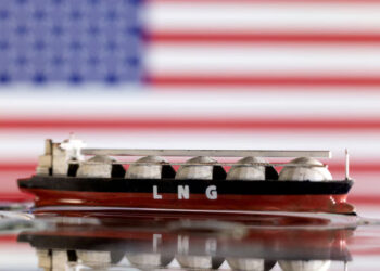 Model of LNG tanker is seen in front of the U.S. flag in this illustration taken May 19, 2022. REUTERS/Dado Ruvic/Illustration/File Photo Purchase Licensing Rights