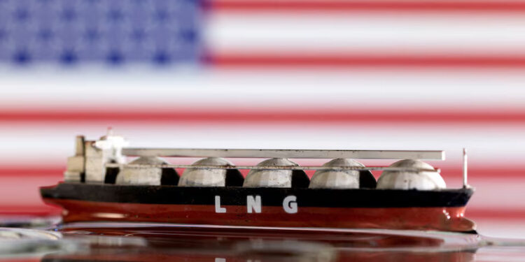 Model of LNG tanker is seen in front of the U.S. flag in this illustration taken May 19, 2022. REUTERS/Dado Ruvic/Illustration/File Photo Purchase Licensing Rights