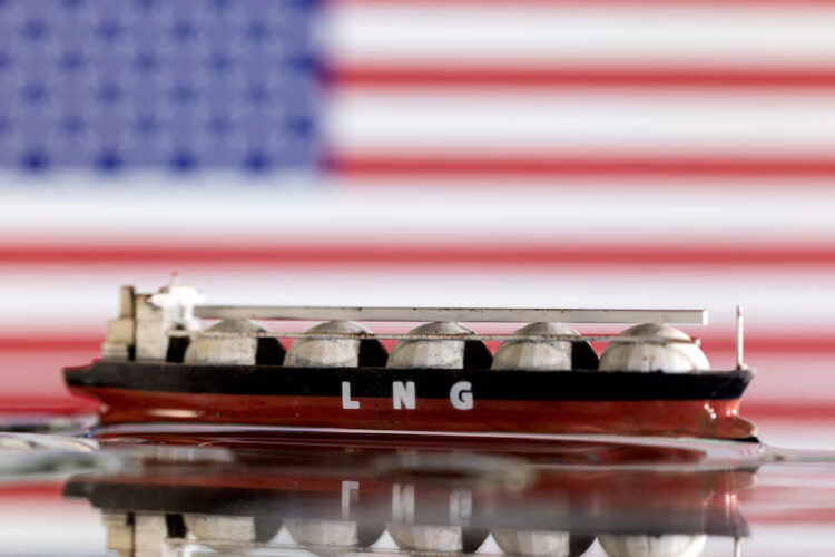 Model of LNG tanker is seen in front of the U.S. flag in this illustration taken May 19, 2022. REUTERS/Dado Ruvic/Illustration/File Photo Purchase Licensing Rights