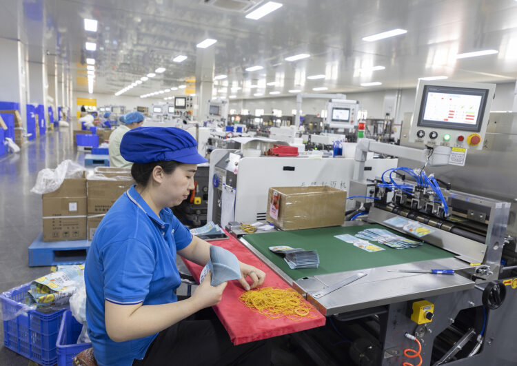 Workers on a line at Dino New Materials Technology Co., Ltd. in the Sihong Economic Development Zone, Suqian, Jiangsu Province, on April 16, 2025. /VCG