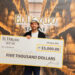 First Place Winner of the El Dorado Rum Heritage Cocktail Competition 2025, Erick Lerch, with cheque.