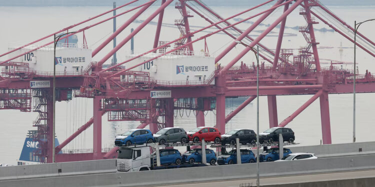 A car carrier transporting vehicles made by South Korea's automaker Kia Motors which is a sister company of South Korea’s biggest automaker company Hyundai Motors travels near Pyeongtaek port in Pyeongtaek, South Korea, April 2, 2025. REUTERS/Kim Hong-Ji