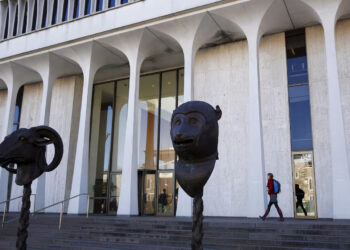 A woman walks by Princeton University's Woodrow Wilson School of Public and International Affairs is seen in Princeton, New Jersey, November 20, 2015. REUTERS/Dominick Reuter/File Photo Purchase Licensing Rights