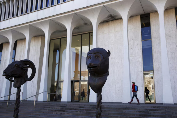 A woman walks by Princeton University's Woodrow Wilson School of Public and International Affairs is seen in Princeton, New Jersey, November 20, 2015. REUTERS/Dominick Reuter/File Photo Purchase Licensing Rights