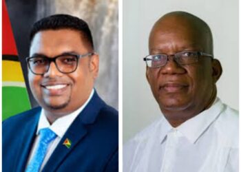 L-R President Irfaan Ali and former Finance Minister Winston Jordan