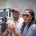Fmr Shadow Minister of Foreign Affairs and International Trade and FGM Presidential Candidate Amanza Walton-Desir (in blue shirt) engaging the press on the death of 11-year-old Arianna Younge