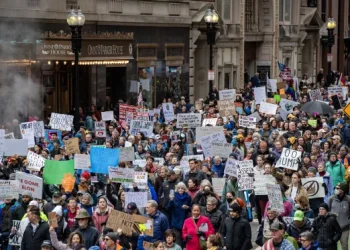 Demonstrators march through the streets during the "Hands Off Massachusetts! Rally/March" in Boston, Mass., on Saturday.Joseph Prezioso / AFP / Getty Images