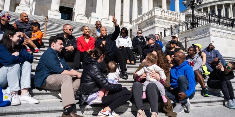 From left, House Minority Leader Hakeem Jeffries, D-N.Y., Maya Wiley, president of the Leadership Conference on Civil and Human Rights, and Sen. Cory Booker, D-N.J., conduct a live-streamed conversation with Americans focused on "our common values, our faith traditions and the moral moment facing our nation," on the House steps of the U.S. Capitol on Sunday, April 27, 2025. Tom Williams/CQ-Roll Call, Inc./Getty Images