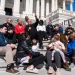 From left, House Minority Leader Hakeem Jeffries, D-N.Y., Maya Wiley, president of the Leadership Conference on Civil and Human Rights, and Sen. Cory Booker, D-N.J., conduct a live-streamed conversation with Americans focused on "our common values, our faith traditions and the moral moment facing our nation," on the House steps of the U.S. Capitol on Sunday, April 27, 2025. Tom Williams/CQ-Roll Call, Inc./Getty Images