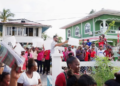 A group of PPP protesters outside of a meeting being held by Azzuddin Mohamed (Stabroek News photo)