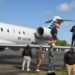 Passengers are seen evacuating American Eagle Flight 5406 after it landed on Tuesday, April 1 at Augusta Regional Airport in Georgia. (APTN/Sean O'Conor)