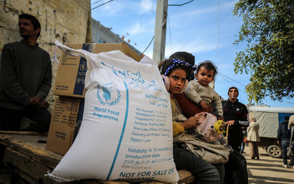 Palestine, Nusierat camp, Deir al-Balah Governorate, Gaza Strip, 25 January 2025 

In the photo: WFP distribution point operated at the Nusierat camp by WFP's partner, Global Communities. 

With the recent surge in humanitarian assistance reaching the Gaza Strip, implementing partners have activated all distribution points to efficiently deliver life-saving food and rations to those in need. This distribution cycle marks the first time in months that WFP has been able to provide full rations, made possible by improved access and the increased flow of aid into our warehouses and distribution sites.
The ceasefire is a critical step toward enabling WFP to reach the most vulnerable with the full assistance they require. For hundreds of thousands of families, the ceasefire offers a sense of security and safety. However, food insecurity remains a pressing concern, prompting families to ensure they reach distribution points to redeem their rations.