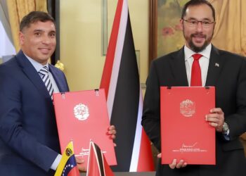 FLASHBACK: Venezuelan Oil Minister Pedro Tellechea, left; and then Energy Minister, now, PM Stuart Young, at the signing ceremony for the Dragon Gas field licence in Caracas, Venezuela in December 2023. -