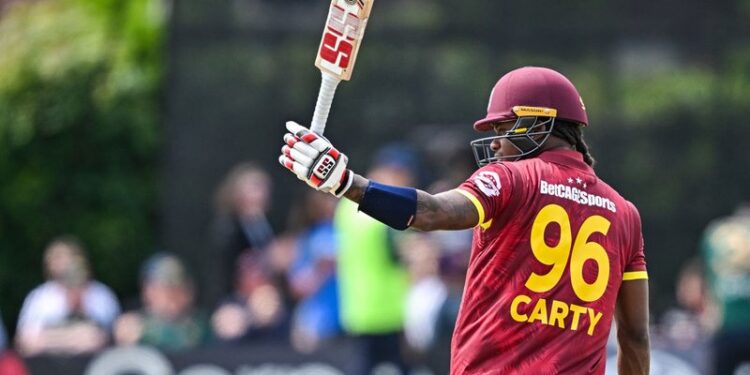Keacy Carty raises his bat after scoring 100 in 2nd ODI v Ireland