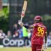 Keacy Carty raises his bat after scoring 100 in 2nd ODI v Ireland