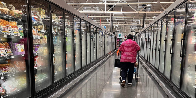 A woman walks down the aisle of a Walmart supermarket in Houston, Texas, on May 15, 2025. /VCG