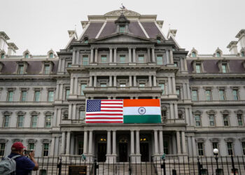 The flags of the United States and India are displayed on the Eisenhower Executive Office Building at the White House in Washington, U.S., June 21, 2023. REUTERS/Elizabeth Frantz/File Photo Purchase Licensing Rights