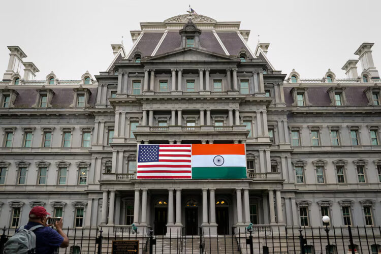 The flags of the United States and India are displayed on the Eisenhower Executive Office Building at the White House in Washington, U.S., June 21, 2023. REUTERS/Elizabeth Frantz/File Photo Purchase Licensing Rights