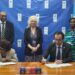 Signing of the agreement for electoral support.
Front Left to Right: Signatories - GECOM Chairman, Justice [ret'd) Claudette Singh and UNDP Resident Representative a.i., Berdi Berdiyev.
Back Left to Right: GECOM CEO, Vishnu Persaud, British High Commissioner H.E. Jane
Miller OBE and United Nations Resident Coordinator, Mean Njeri Kamau
