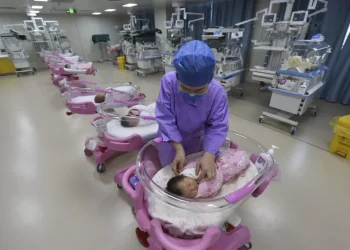 File photo of a nurse taking care of newborn babies in a maternity hospital in Fuyang in central China's Anhui province Monday, Aug. 08, 2022. AP